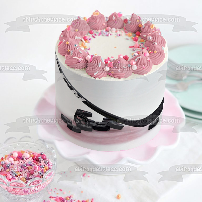 Hockey Stick and Pucks on Ice Rink Edible Cake Topper Image ABPID55828