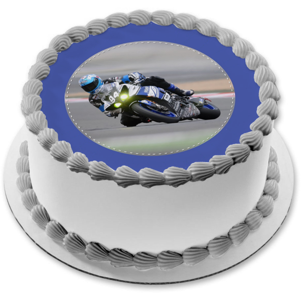 Motorcycle Racer with a Blue Bike and a Blue Background Edible Cake Topper Image ABPID06893