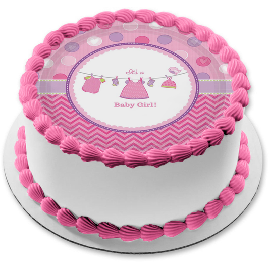 Es una niña bebé ducha ropa de bebé en un tendedero adorno comestible para pastel imagen ABPID00447 