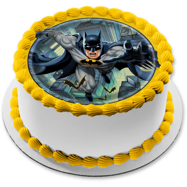Batman Flying Over City Yellow Round Edge Edible Cake Topper Image ABPID01391