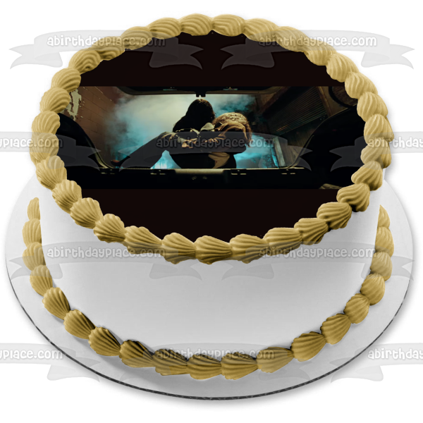 Malignant Madison Mitchell Being Put In a Car Trunk Edible Cake Topper Image ABPID54746