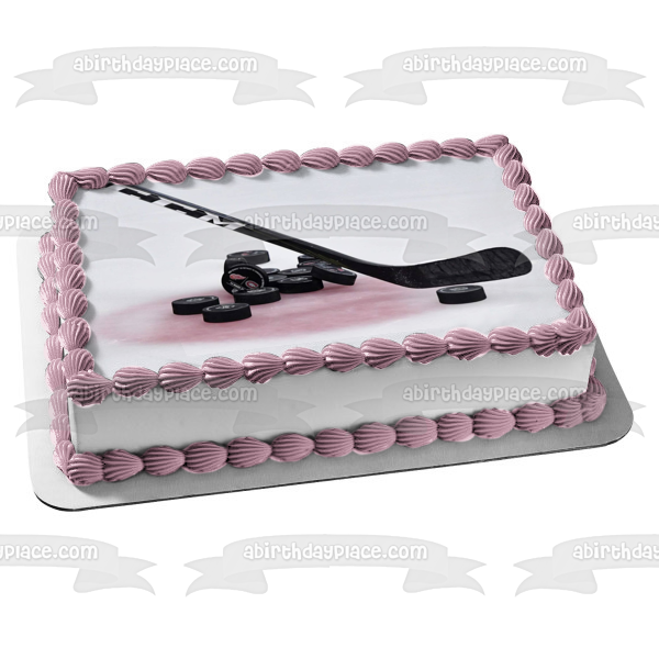 Hockey Stick and Pucks on Ice Rink Edible Cake Topper Image ABPID55828